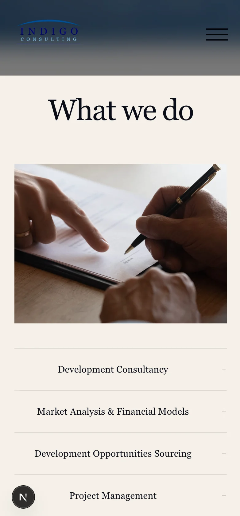 Indigo Consulting mobile website showing services and consultancy expertise in a black iPhone mockup